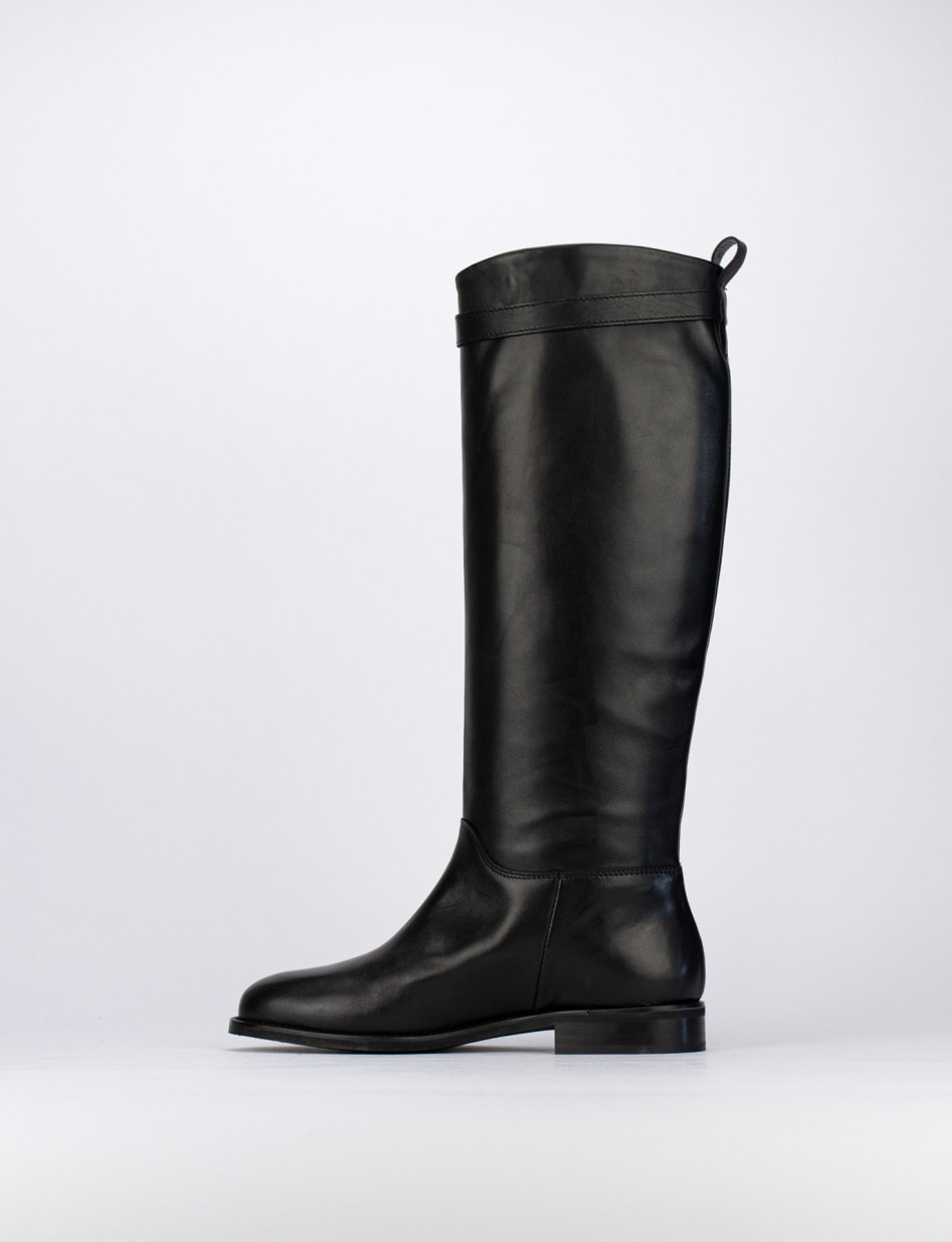 Tall black leather boots with low heel top