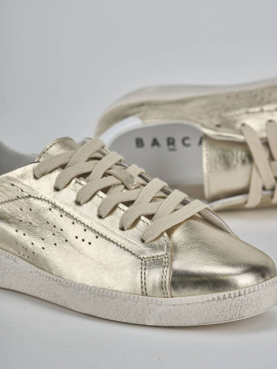 Sneakers laminato oro